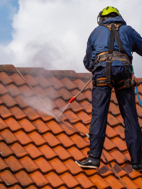 Worker,Washing,The,Roof,With,Pressurized,Water